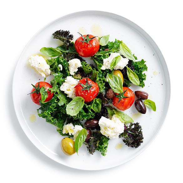 Fresh, quick, and healthy – Try our kale, tomato and olive salad.