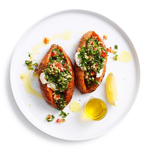 Split, stuff and share! Try our sweet potato split – with kale and parsley tabouli and labne.